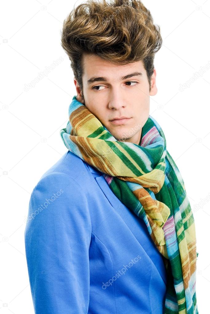 Attractive young man wearing blue jacket and scarf