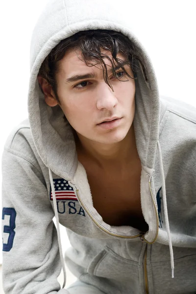 Handsome young man in a hood — Stock Photo, Image