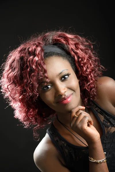 Beautiful black woman on black background. Studio shot — Stock Photo, Image