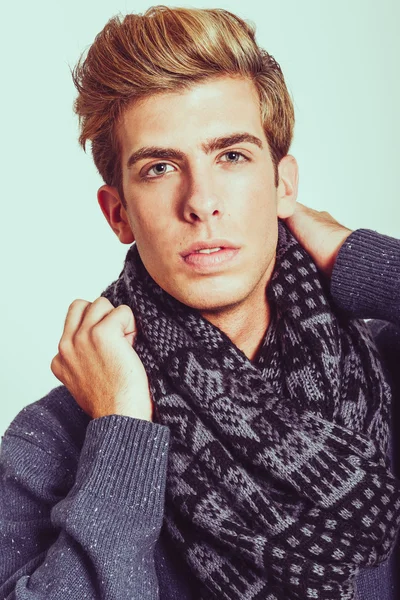 Portrait of good looking blonde man wearing a scarf — Stock Photo, Image