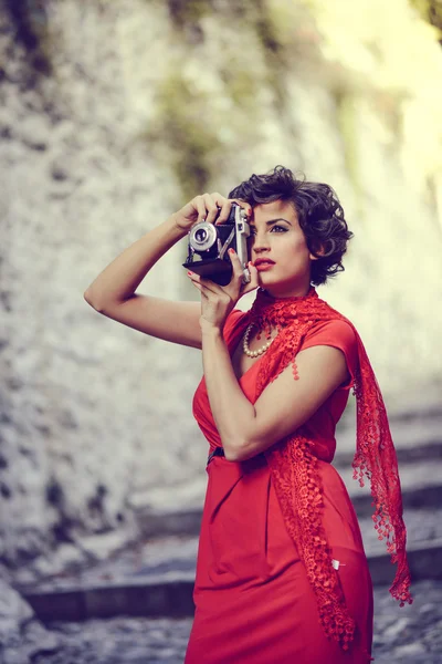 Beautiful woman in urban background. Vintage style