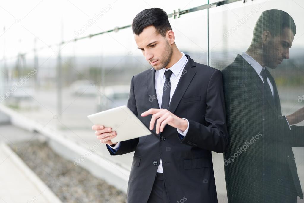 Businessman with tablet computer in office building