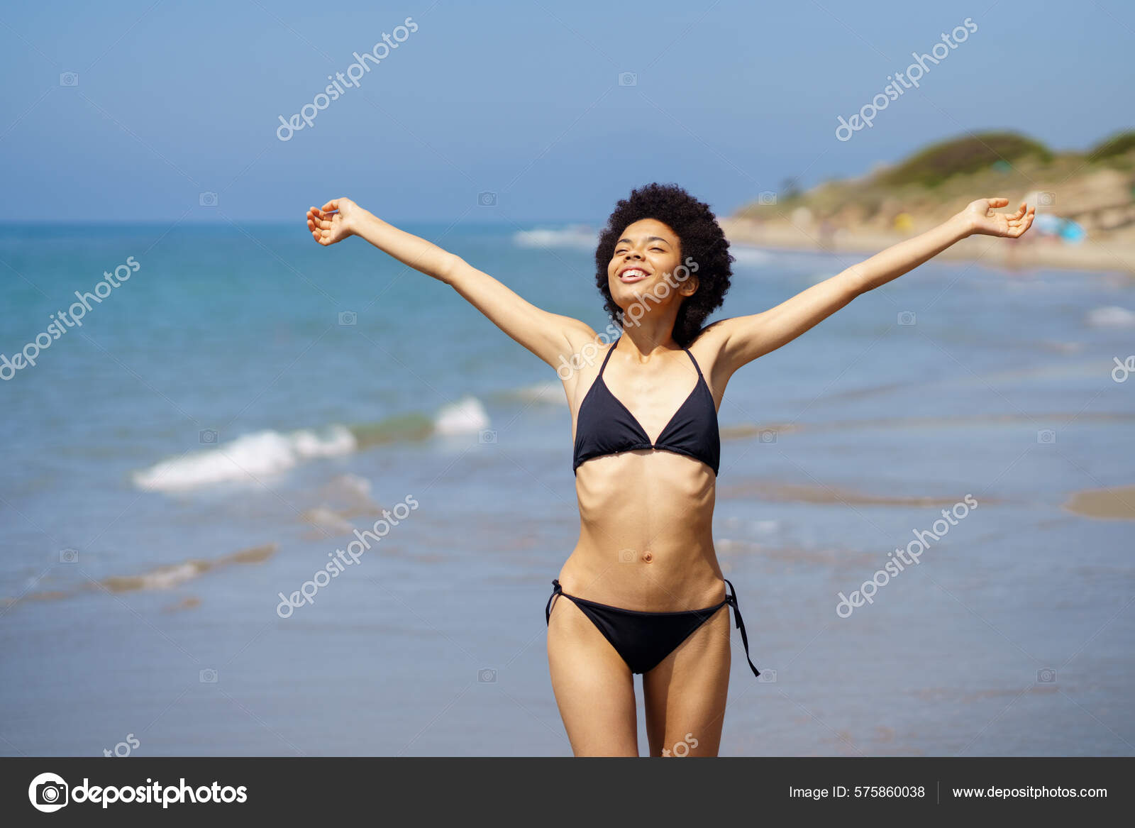 Positive African American Female Tourist Swimwear Walking Coast