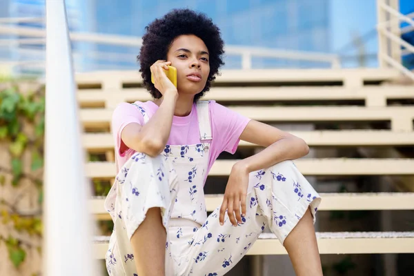 Serious African American Female Overall Looking Away While Having Phone — Stockfoto