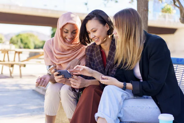 Content Young Multiracial Women Best Friends Casual Clothes Hijab Smiling — Stockfoto