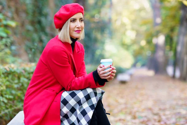 Side View Female Wearing Red Warm Outerwear Sitting Cup Takeaway — Zdjęcie stockowe