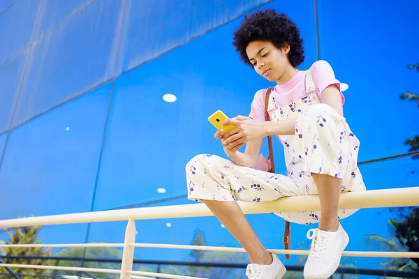 Concentrated African American Female Casual Clothes Scrolling Social Media Smartphone — Stockfoto