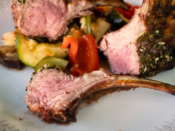 Rack of Lamb Grilled Medium Rare or Pink with Ratatouille Vegetables and Persillade