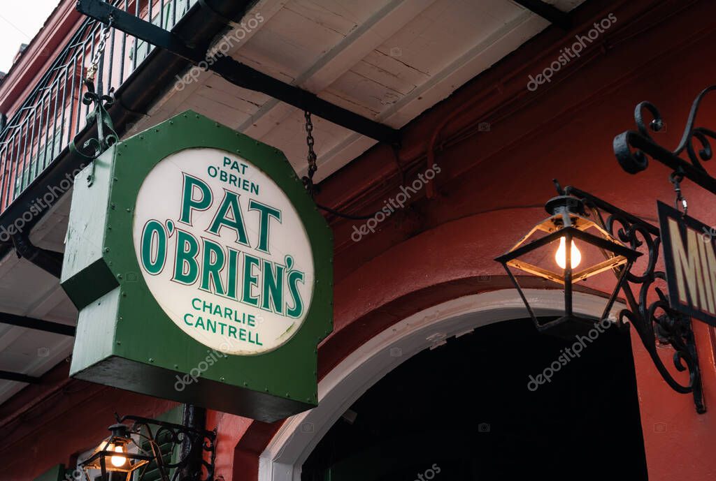 New Orleans, Louisiana, United States - July 17 2009: Pat O'Brien's Courtyard Resstaurant and Bar Entrance Sign or Logo on Bourbon Street in the Vieux Carre.