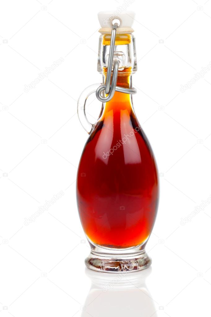 Bottle of ardent drink / mixture, on white background.