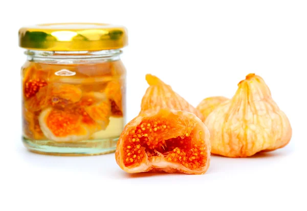 Delicious figs fruit, and glass jar with figs, on white background — Stock Photo, Image