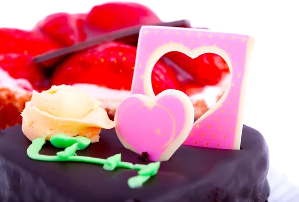 Chocolate cake with heart decoration — Stock Photo, Image