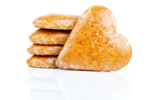 Cookies-hearts connected by a red tape on a white background — Stock Photo, Image