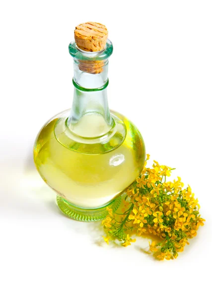 Fresh rapeseed oil in a bottle, isolated on a white background — Stock Photo, Image