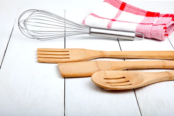 Wooden kitchen set with tea towel, on wooden white background. — Stock Photo, Image