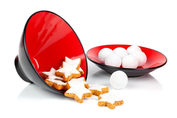 Star shaped biscuit on red bowl, on white background — Stock Photo, Image