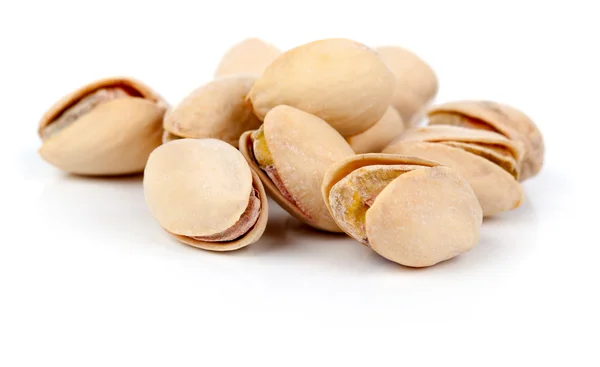 Pistachios heap against white background — Stock Photo, Image