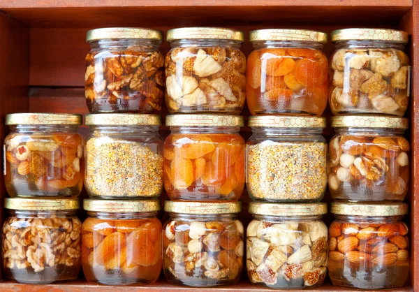 Colorful honey with fruit and nuts in the jar, on a market in cr — Stock Photo, Image