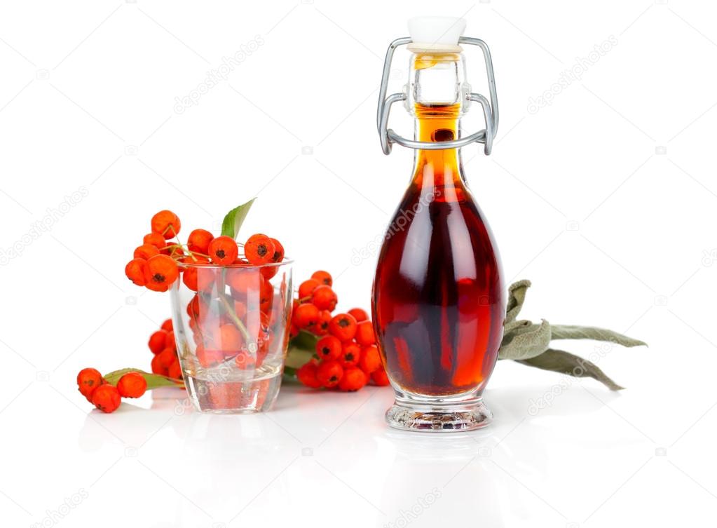 bottle of drink, mixture with ashberry on white background.