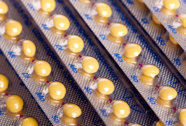 Tabletki (pigułki antykoncepcyjne) tło — Zdjęcie stockowe