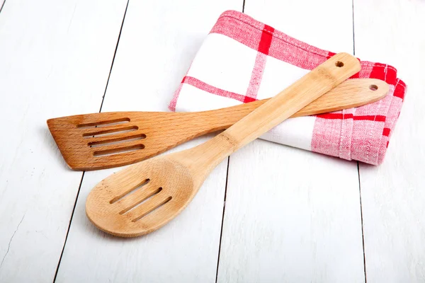 Wooden kitchen set with tea towel, on wooden white background. — Stock Photo, Image