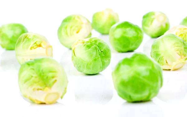 Fresh green brussels sprouts, on a white background — Stock Photo, Image