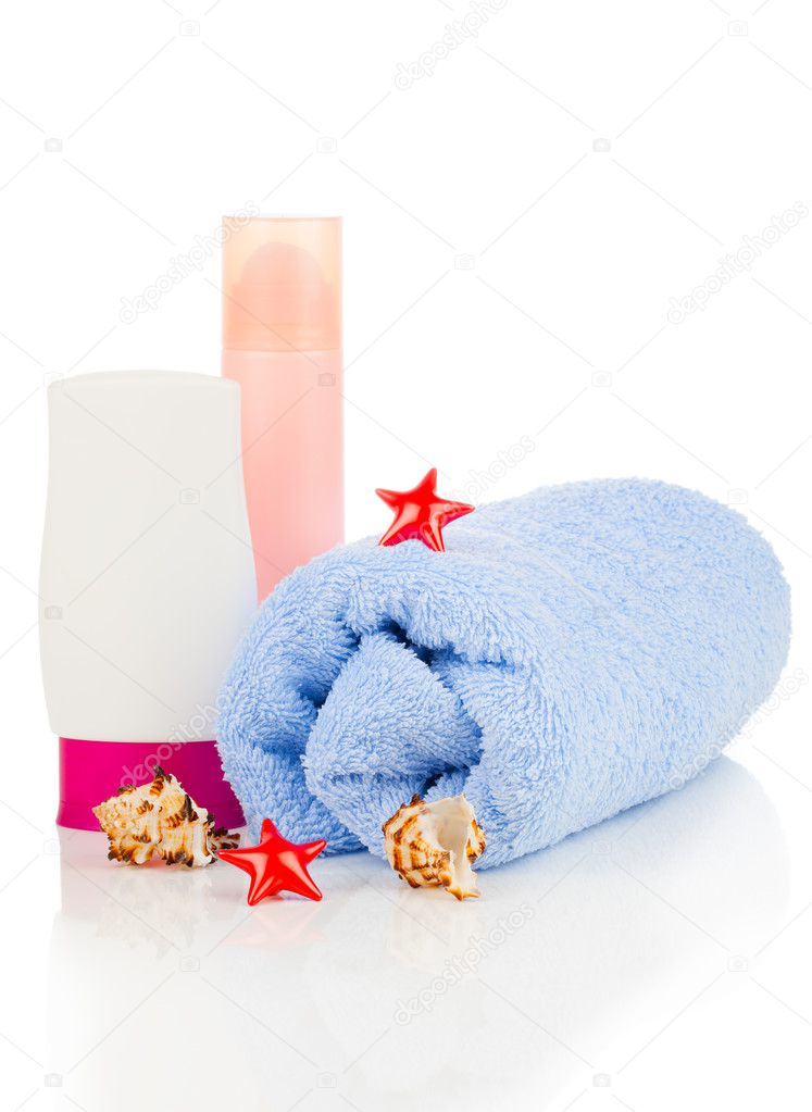 sunscreen cream and bath towel isolated on white