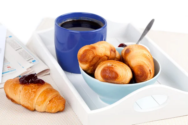Fresh coffee and tasty croissant in a tray for breakfast. Royalty Free Stock Images