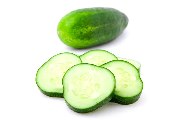 Cucumber and slices isolated over white background. — Stock Photo, Image