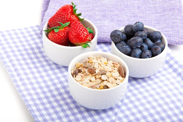 Fresh blueberry, strawberries, corn flakes in the porcelain bowl — Stock Photo, Image