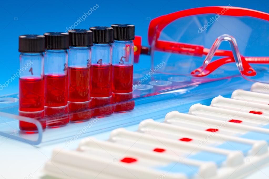 Array of blood samples for microscopy and biopsy tissue on blue