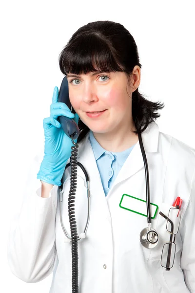 Portrait of a friendly female doctor using a telephone — Stock Photo, Image