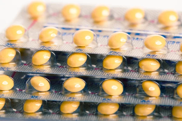 Tablety (antikoncepční pilulky) pozadí — Stock fotografie
