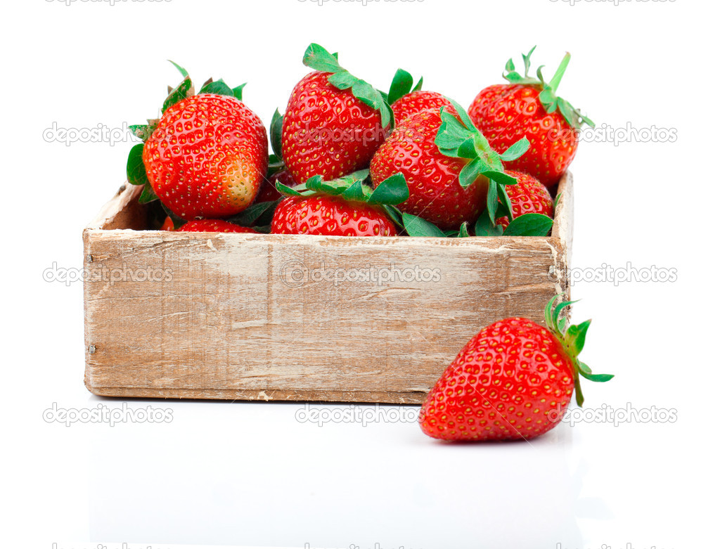 Strawberries berry in the wooden box, isolated on white backgrou
