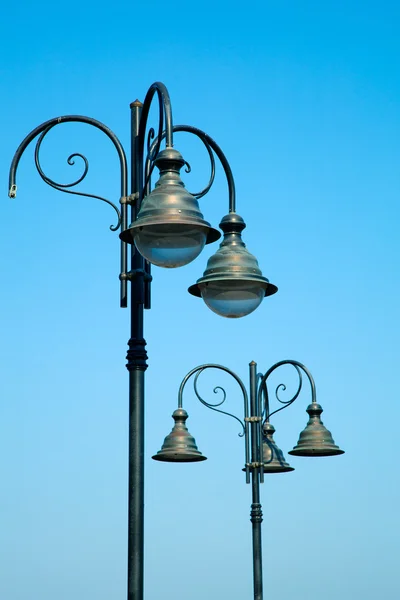 Old street-lamp on blue sky — Stock Photo, Image