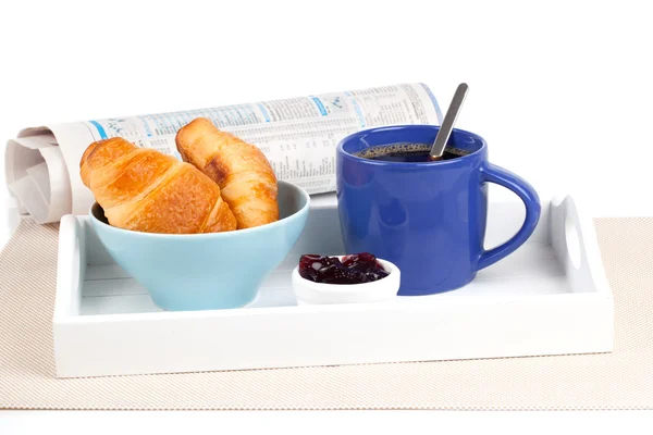 Fresh coffee and tasty croissant in a tray for breakfast. with n Stock Photo