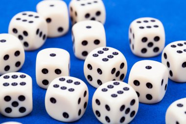Dice rolling on blue background clipart