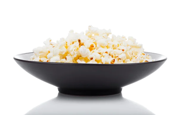 Popcorn in a bowl, isolated on white — Stock Photo, Image