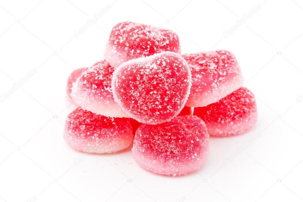 heap of heart-shaped candies isolated on white background