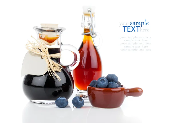 Blueberry syrup in glass bottle or mixture, with heart label. on — Stock Photo, Image