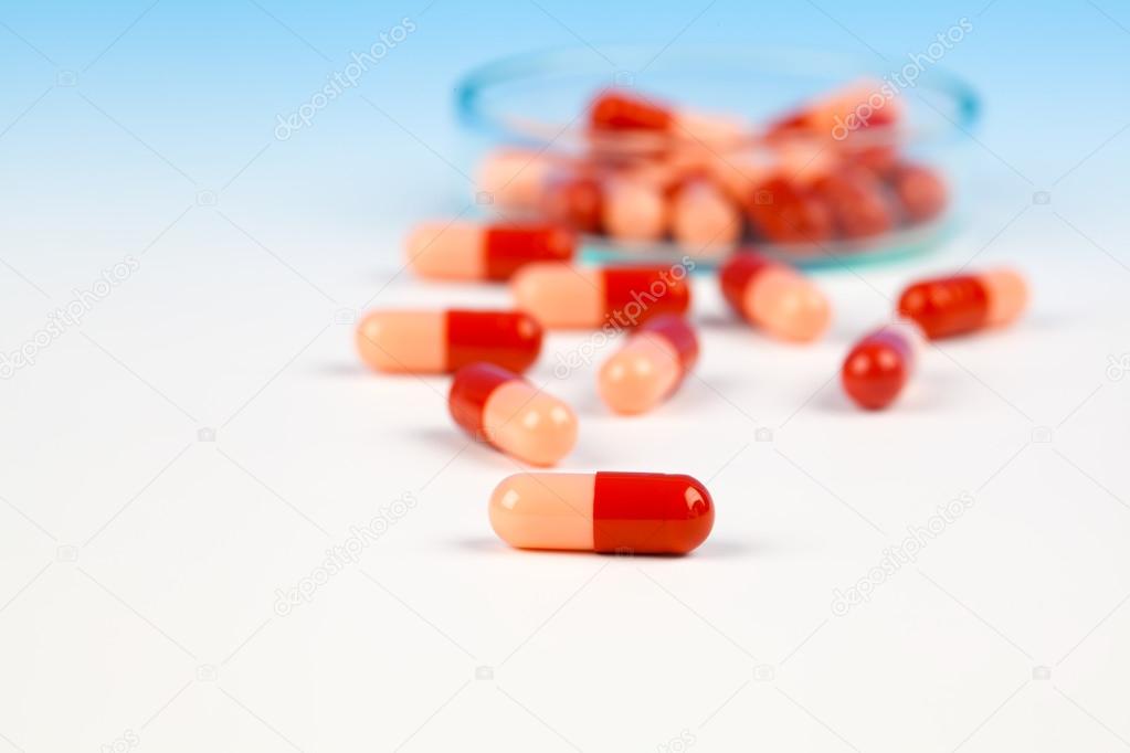 Pills spilling out, tablet antibiotic pills. Laboratory concept.