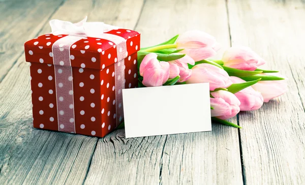 Beautiful tulips with red polka-dot gift box. happy mothers day, — Stock Photo, Image