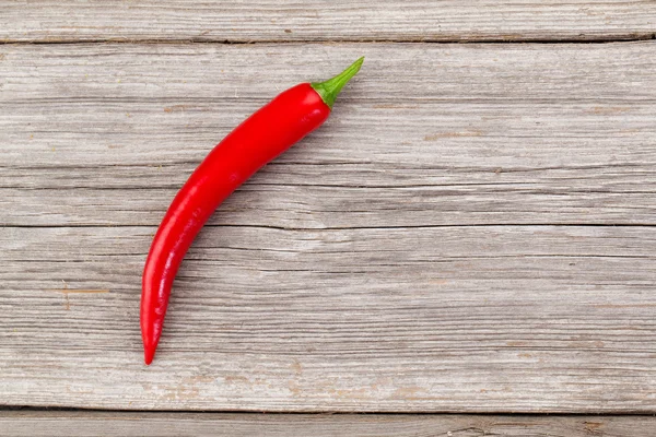 Red chili pepper on the wooden background — Stock Photo, Image
