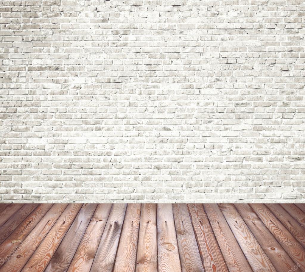 Interior room with white brick wall and wooden floor