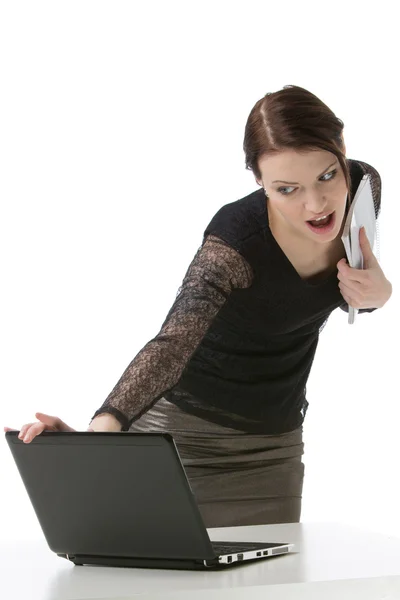 Woman in fron of notebook. Isolated on white — Stock Photo, Image