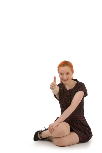 親指を与える幸せな赤毛の女性 ストックフォト