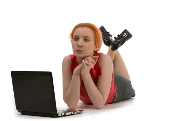 Thoughtful woman working on a laptop — Stock Photo, Image