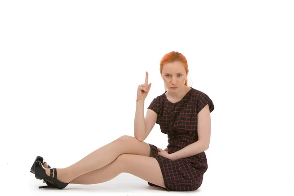Woman pointing above her head — Stock Photo, Image