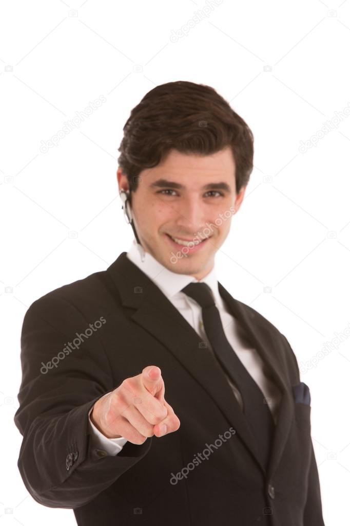 Businessman smiling and pointing forwards