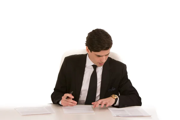 Homme d'affaires travaillant à son bureau Images De Stock Libres De Droits